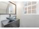 Contemporary bathroom with vessel sink, dark vanity, and frameless shower at 2862 Filbert St, Raleigh, NC 27610