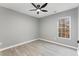 Bright bedroom with ceiling fan and wood-look floors at 2862 Filbert St, Raleigh, NC 27610