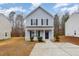 Two-story light blue house with black shutters and a concrete walkway at 2862 Filbert St, Raleigh, NC 27610
