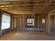 Interior framing of a room under construction, showing a window at 30 Seahawk Way, Zebulon, NC 27597