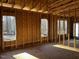Interior framing of a room under construction, featuring a wall of windows at 30 Seahawk Way, Zebulon, NC 27597
