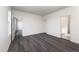 Bright bedroom with wood-look flooring and access to bathroom at 339 Suhani Ln, Clayton, NC 27520