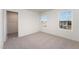 Bright bedroom with carpeted floor and walk-in closet at 339 Suhani Ln, Clayton, NC 27520
