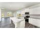 Modern kitchen features white cabinets, granite countertops and stainless steel appliances at 339 Suhani Ln, Clayton, NC 27520