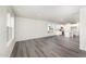 Open floor plan with hardwood floors, kitchen, and ample natural light at 339 Suhani Ln, Clayton, NC 27520