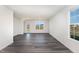 Spacious living room with gray vinyl plank flooring and lots of natural light at 339 Suhani Ln, Clayton, NC 27520
