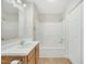 Bathroom with tub, vanity, and updated flooring at 3727 Votive Ln, Raleigh, NC 27604