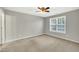 Bright bedroom with neutral walls and carpet flooring at 3727 Votive Ln, Raleigh, NC 27604