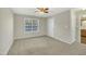 Spacious bedroom with carpet, ceiling fan, and window at 3727 Votive Ln, Raleigh, NC 27604