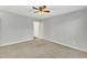 Bright bedroom featuring ceiling fan and plush carpeting at 3727 Votive Ln, Raleigh, NC 27604