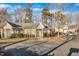 Attractive single-story residence featuring beige siding, white windows, and lush landscaping for added curb appeal at 3727 Votive Ln, Raleigh, NC 27604