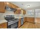 Kitchen with stainless steel appliances and wood cabinets at 3727 Votive Ln, Raleigh, NC 27604