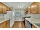 Updated kitchen with wood cabinets and new flooring at 3727 Votive Ln, Raleigh, NC 27604