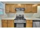 Stainless steel range and overhead microwave at 3727 Votive Ln, Raleigh, NC 27604