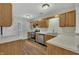 Modern kitchen with stainless steel appliances and light wood cabinets at 3727 Votive Ln, Raleigh, NC 27604