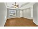 Spacious living room with wood-look floors and a ceiling fan at 3727 Votive Ln, Raleigh, NC 27604