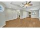 Open living room with hardwood floors, leading to kitchen and bathroom at 3727 Votive Ln, Raleigh, NC 27604