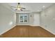 Living room with wood-look floors, neutral walls, and a ceiling fan at 3727 Votive Ln, Raleigh, NC 27604