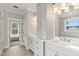 Elegant bathroom featuring dual sinks, vanity with drawers, and natural lighting at 3912 Cedar Knolls Dr, Youngsville, NC 27596