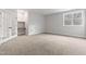 Spacious bedroom with carpet floors, white trim, built in desk, and a window with a view at 3912 Cedar Knolls Dr, Youngsville, NC 27596