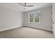 Spacious bedroom with a ceiling fan and a large window that offers a beautiful view of the outdoors at 3912 Cedar Knolls Dr, Youngsville, NC 27596