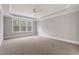 Large, bright bedroom featuring a ceiling fan and multiple windows for ample natural lighting at 3912 Cedar Knolls Dr, Youngsville, NC 27596