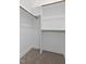Walk-in closet with built-in shelving, rods for hanging clothes, and carpet floors at 3912 Cedar Knolls Dr, Youngsville, NC 27596