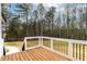Spacious wooden deck with black railings, offering a private outdoor space at 3912 Cedar Knolls Dr, Youngsville, NC 27596