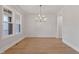 Bright dining room with stylish lighting, large windows, and decorative wall paneling at 3912 Cedar Knolls Dr, Youngsville, NC 27596
