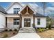 Charming home featuring a welcoming entrance with stone steps and a covered porch at 3912 Cedar Knolls Dr, Youngsville, NC 27596
