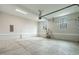Unfinished garage with concrete flooring and windows providing natural light at 3912 Cedar Knolls Dr, Youngsville, NC 27596