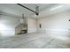 Unfinished garage with concrete flooring and access to a staircase at 3912 Cedar Knolls Dr, Youngsville, NC 27596