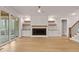 Cozy living area featuring a fireplace, built-in shelving, and sliding glass doors to the outdoor porch at 3912 Cedar Knolls Dr, Youngsville, NC 27596