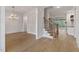 Open-concept space showcasing hardwood floors, white trim, and abundant natural light at 3912 Cedar Knolls Dr, Youngsville, NC 27596