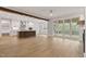 Spacious open layout with hardwood floors, island kitchen, and sliding doors to the porch at 3912 Cedar Knolls Dr, Youngsville, NC 27596