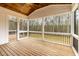 Screened porch with wood ceiling, deck flooring, and views of the outdoors at 3912 Cedar Knolls Dr, Youngsville, NC 27596