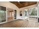 Screened porch with wood ceiling, deck flooring, with sliding doors and windows at 3912 Cedar Knolls Dr, Youngsville, NC 27596