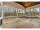 Screened porch with wood ceiling, deck flooring, and views of the outdoors at 3912 Cedar Knolls Dr, Youngsville, NC 27596