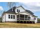 View of the screened porch and deck, highlighting the outdoor living space at 3912 Cedar Knolls Dr, Youngsville, NC 27596