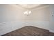 Bright dining room with wainscoting and hardwood floors at 46 Streamline Ct, Lillington, NC 27546