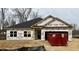 New construction home featuring large windows and attached two car garage at 46 Streamline Ct, Lillington, NC 27546