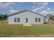 Rear view of a single-story house with a small patio at 464 Dasu Dr, Clayton, NC 27520