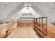 Spacious attic featuring plywood flooring, shelving, and spray foam insulation at 7320 Dunsany Ct, Wake Forest, NC 27587
