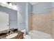 Clean bathroom features a granite vanity, a shower-tub combo with tile surround, and light blue paint at 7320 Dunsany Ct, Wake Forest, NC 27587
