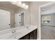 Bathroom featuring dual sinks, a mirror and neutral accents at 7320 Dunsany Ct, Wake Forest, NC 27587