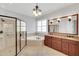 Luxurious bathroom with a glass shower, soaking tub, and double vanity sinks at 7320 Dunsany Ct, Wake Forest, NC 27587