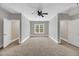 Bright bedroom with neutral tones, ceiling fan, and lots of natural light at 7320 Dunsany Ct, Wake Forest, NC 27587