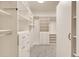 Walk-in closet featuring custom shelves and drawers to maximize storage space at 7320 Dunsany Ct, Wake Forest, NC 27587