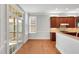 Bright dining area with natural light, hardwood floors, and a view into the kitchen at 7320 Dunsany Ct, Wake Forest, NC 27587