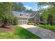 Beautiful home exterior with stone accents, a two-car garage, and a well-maintained lawn at 7320 Dunsany Ct, Wake Forest, NC 27587